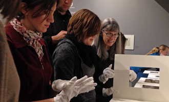 Art and Art History Department Chair Anne McCauley (right) with Fall 2015 History of Prints students in the Dickinson Gallery.