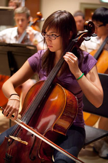 An Albion College student plays the cello.