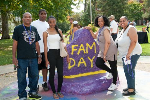 Albion College Student and family outside on family day.