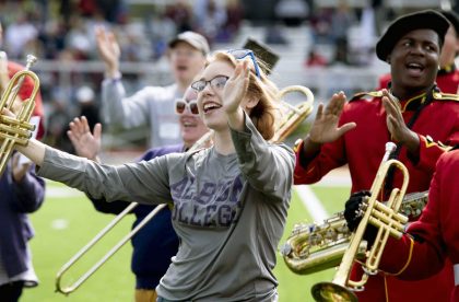 Members of the Albion College marching band on the field.