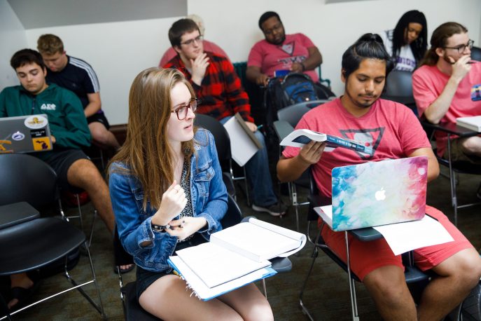 Albion students listening to a lecture in a classroom setting.