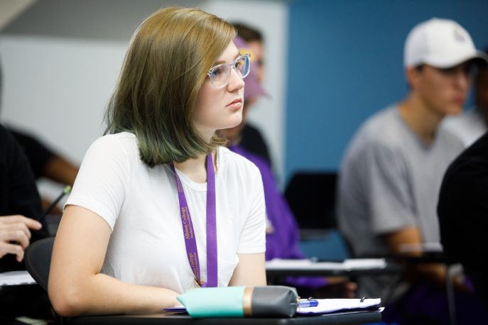 Student listening in a classroom setting.