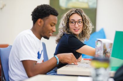 Two students working at a table