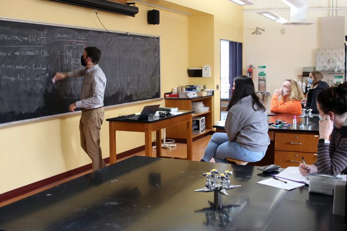 Albion College faculty member leads a class in lab