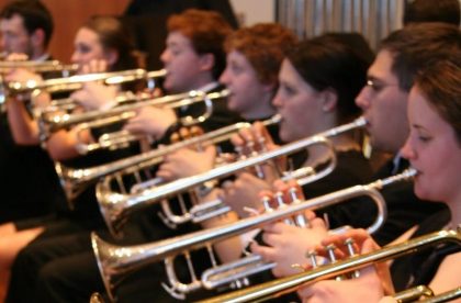 Group of students playing brass instruments.