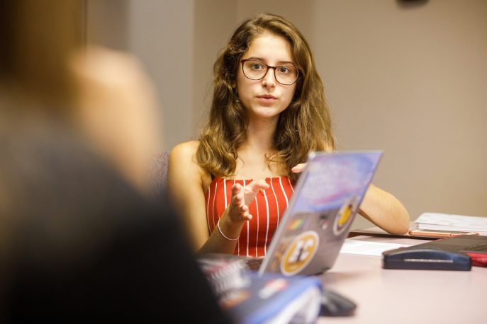 A student in conversation in the classroom.