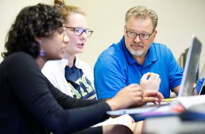 David Reimann (right), professor of mathematics and computer science, with two Albion College students.