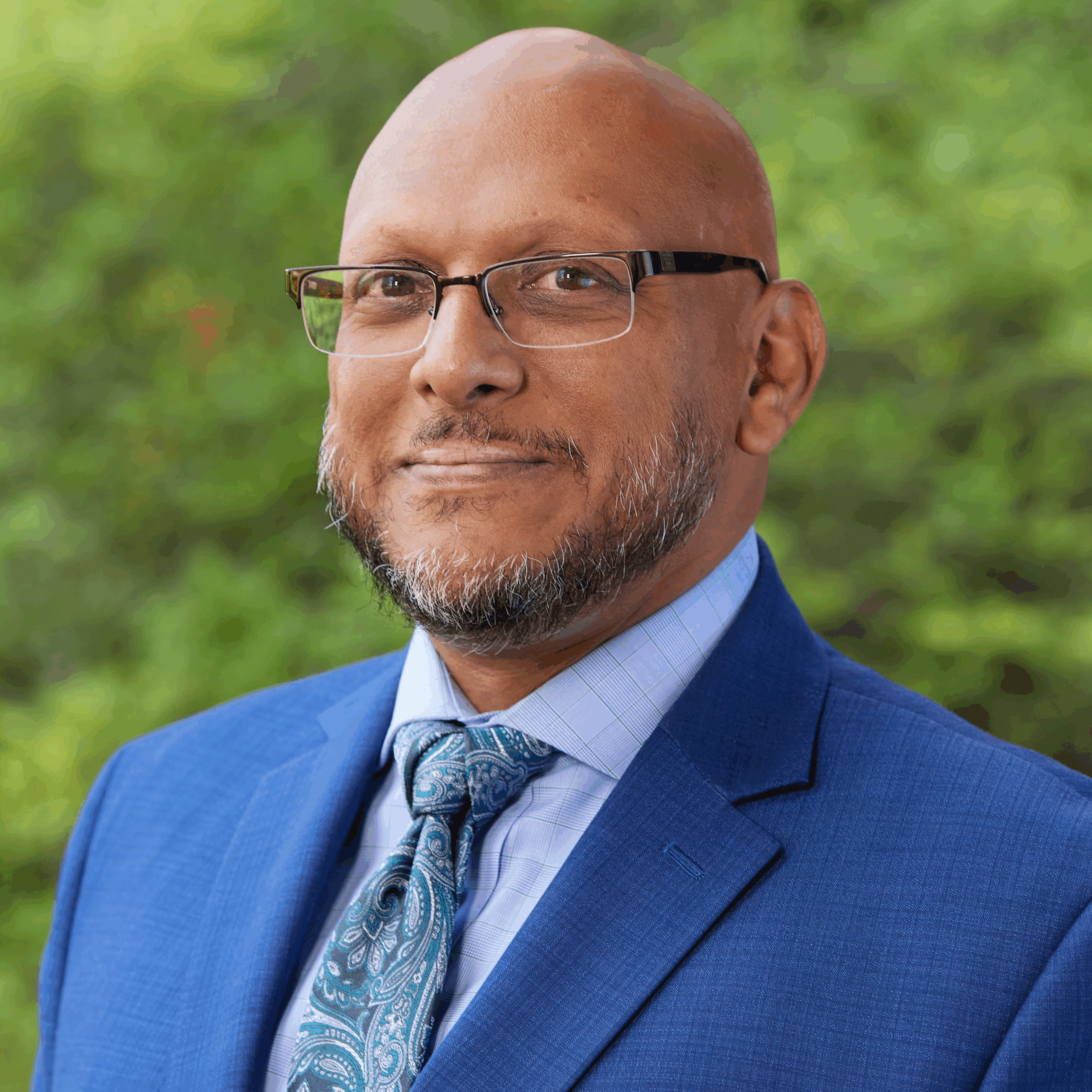 A professional portrait of Roy Mathews.