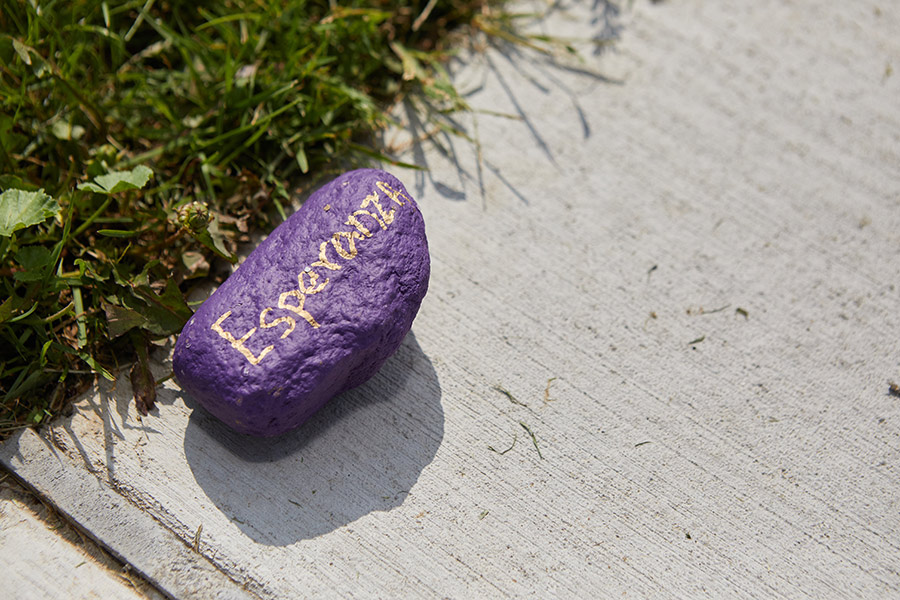 Student-painted rock on a Quad walkway, August 2021.