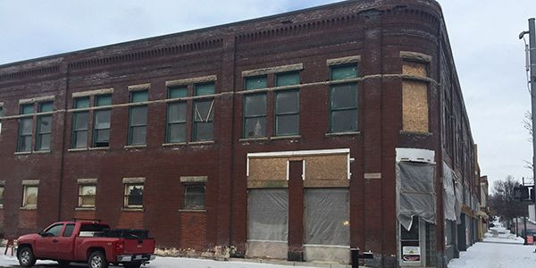 A brick building under construction.