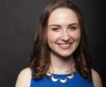 A headshot of a student in a blue shirt.