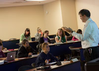 Students observing professor in a classroom