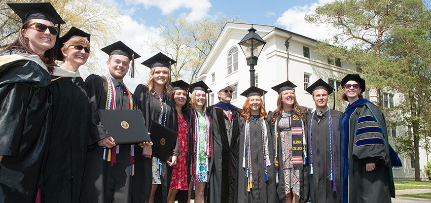 A group of students and professors in their caps and gowns.