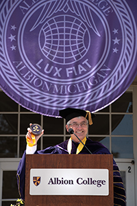 Albion College presient Mauri Ditzler behind a podium at commencement.