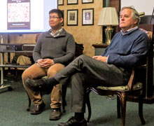 Two men sitting in chairs.