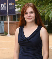 A student smiling at the camera.