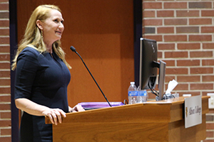 A speaker behind a podium.