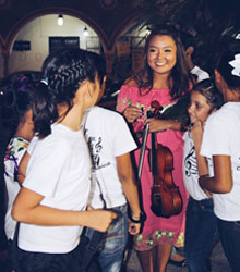 Sunny Kim with students in Izamal preparing for their first recital. Kim, an Albion sophomore, is from Midland, Mich., and a graduate of H.H. Dow High School.