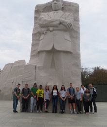 Students posed in front of the Martin Luther King monument in D.C.