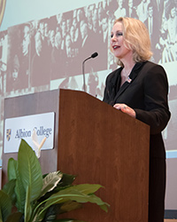 A speaker standing behind a podium.