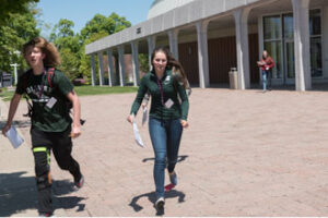 Students walking outside on campus.