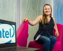 A person sitting in a red chair.