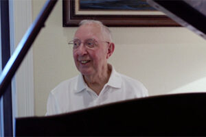 A man sitting at a piano.