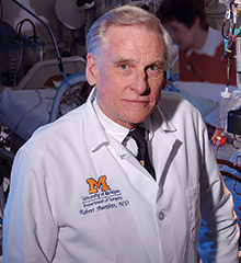A man wearing a lab coat.