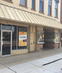 A photo of an empty storefront in downtown Albion.