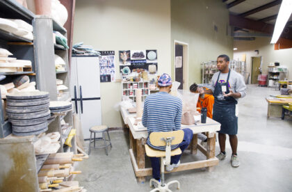 Two students working in the ceramics studio.