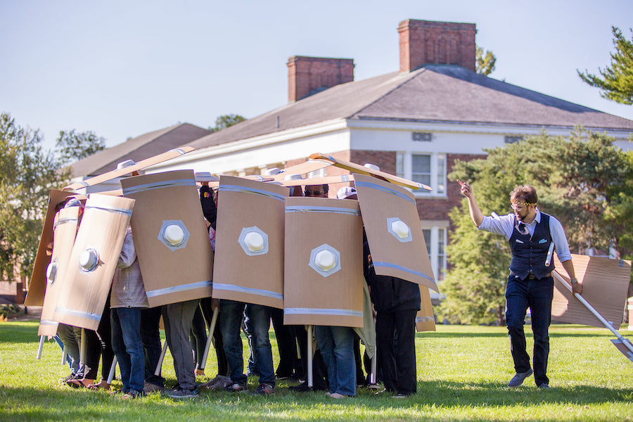Students practice ancient Roman marching techniques on the Quad.