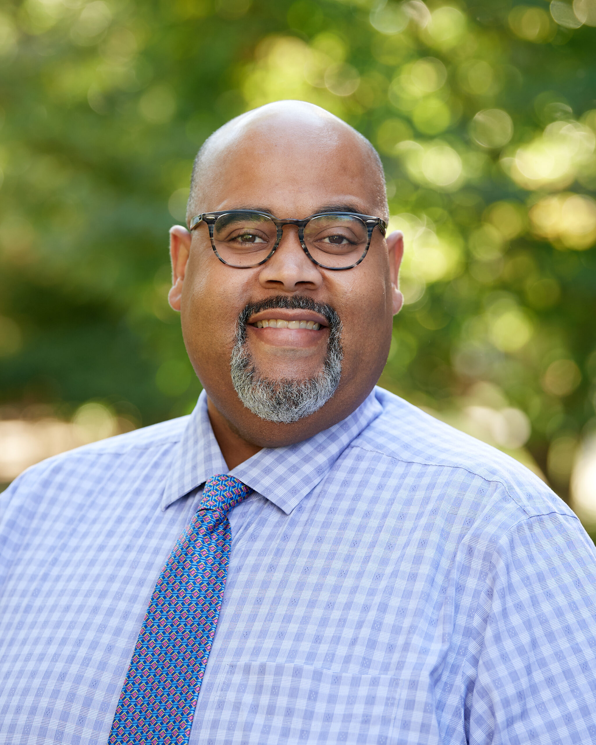 A professional headshot of Leroy Wright.