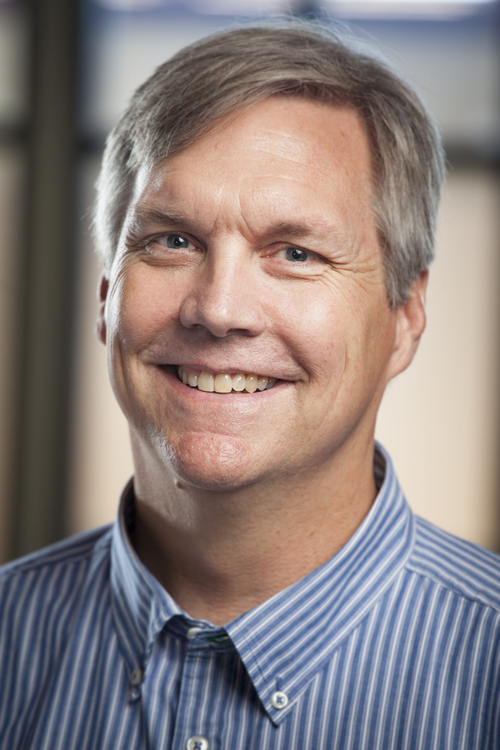 A professional headshot of Drew Dunham.