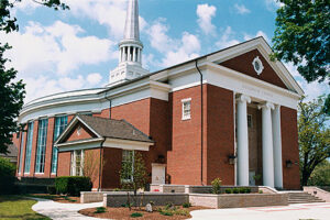 The outside of Goodrich Chapel, a brick building with white columns.