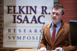 A student making a presentation during the Elkin Isaac Research Symposium.