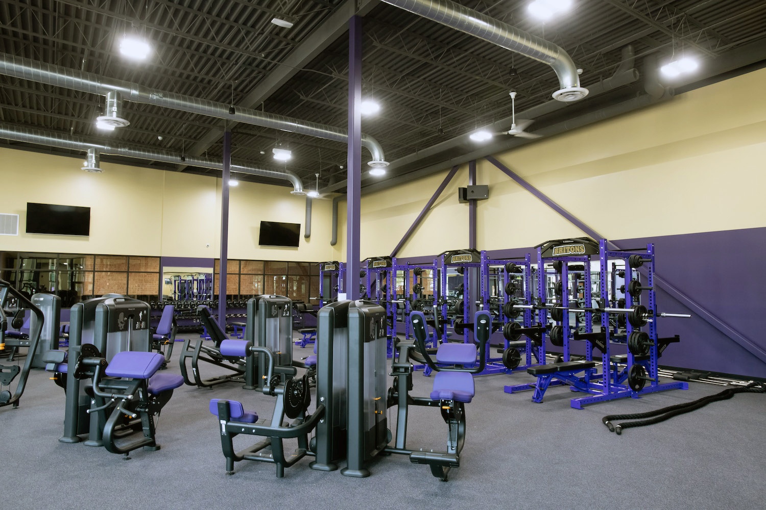 An array of purple exercise machines in the expanded Serra Fitness Center