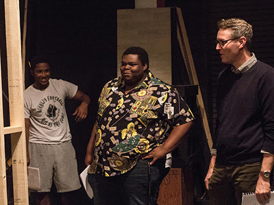 Theatre professor Zach Fischer and students discuss set production.