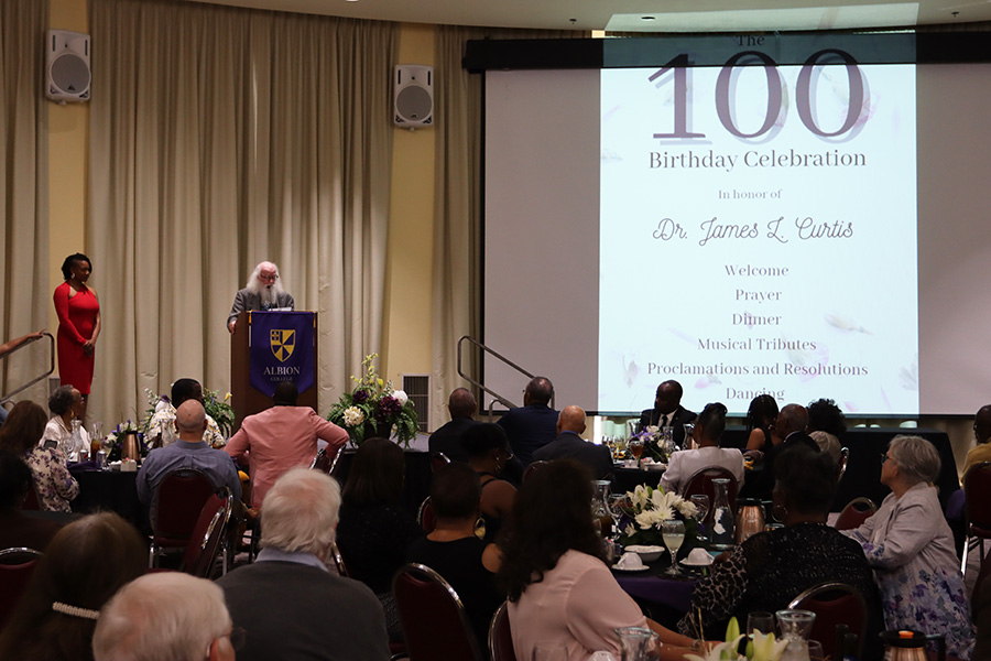 Dr. Wesley Arden Dick gives remarks in Upper Baldwin, Albion College.