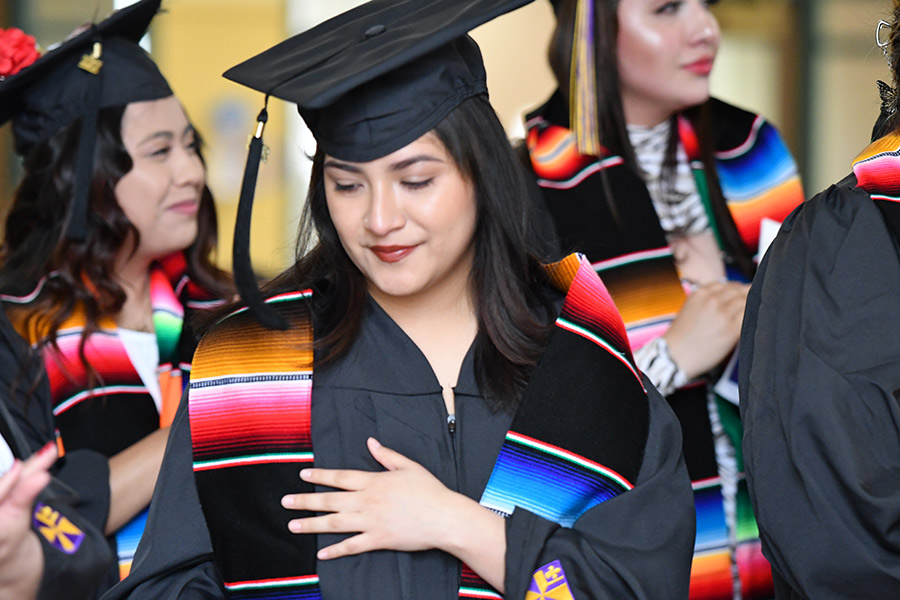 A student wearing her stole.