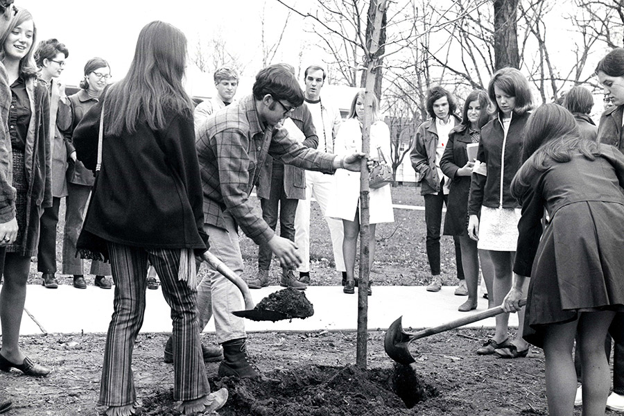 Walt Pomeroy, '70, plants a tree on campus with other Albion students during the first Earth Day, April 22, 1970.