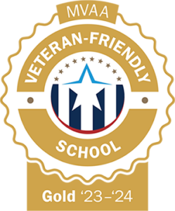 A gold seal with a stars and strips design with a large star in the center. The text around the seal reads MVAA Veteran-Friendly School Gold 2023-24